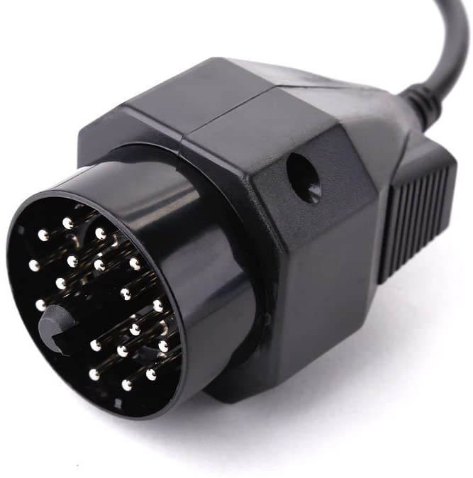 Close-up of the BMW 20-pin plug that fits the round port on the strut tower